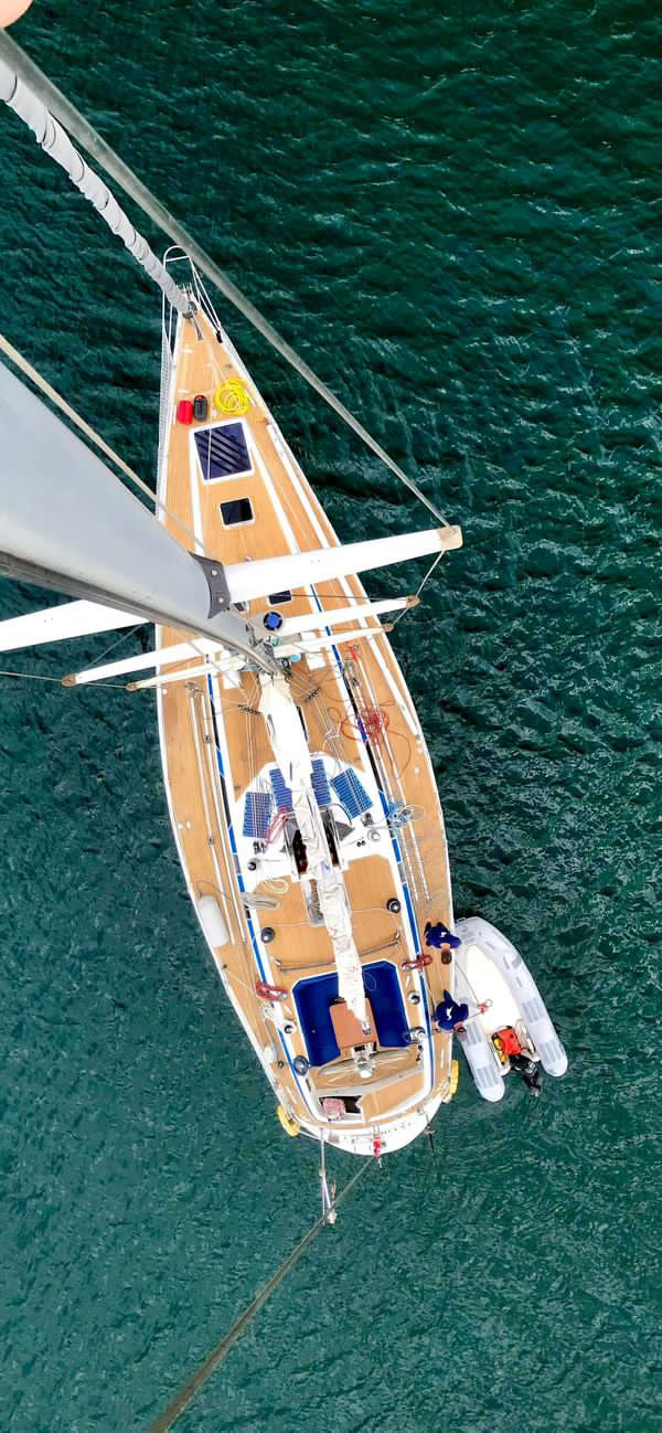SY Cormorant seen from directly above the masthead, tender alongside